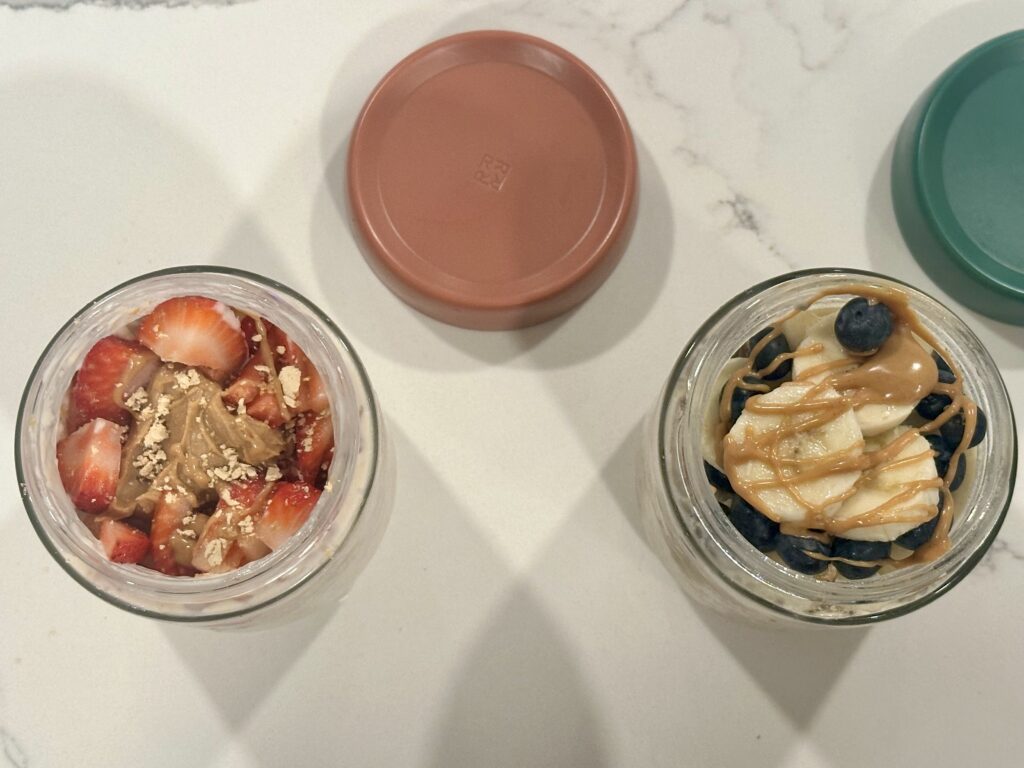 Strawberry Peanut Butter Overnight Oats and Blueberry Peanut Butter Overnight Oats in glass jars ready for meal prep breakfast.