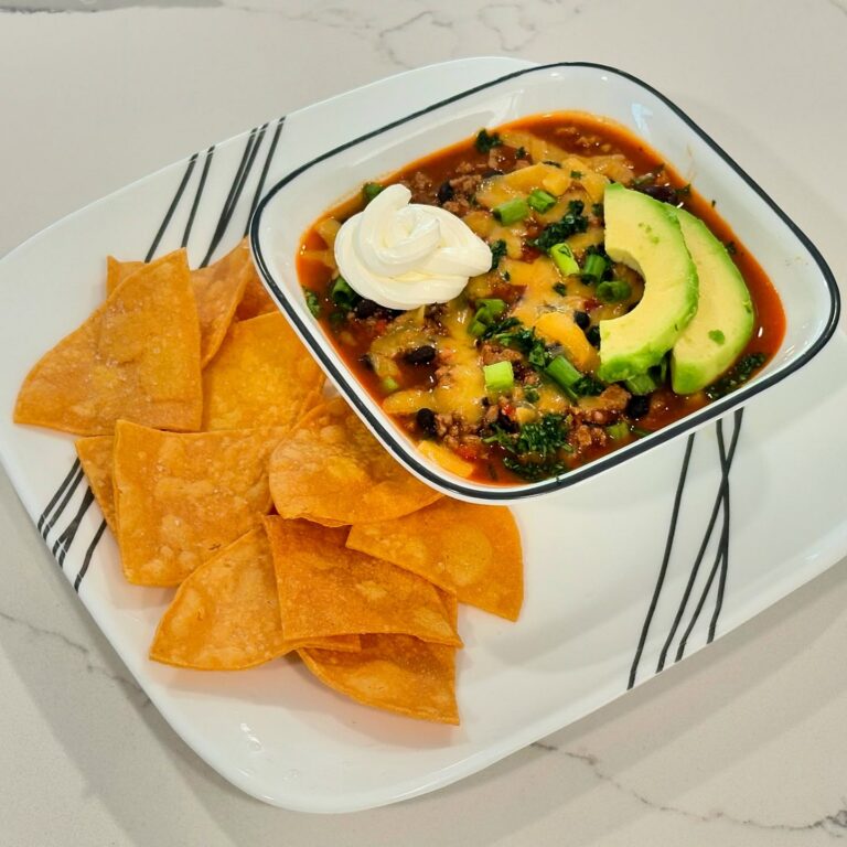 Smoky turkey and black bean chili topped with cheddar cheese, avocado, sour cream, cilantro, and green onion served with homemade crispy corn tortilla chips.