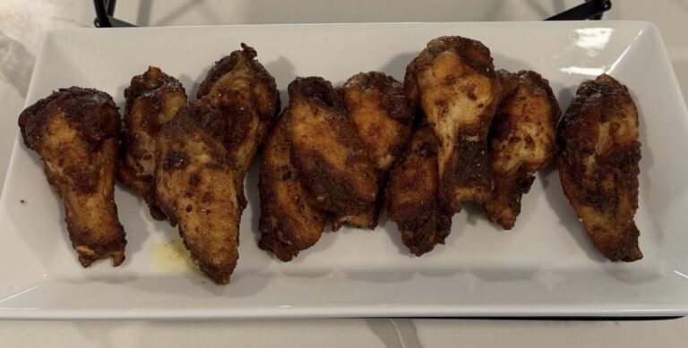 Crispy fried chicken wings tossed in butter and Badia Mango Pepper seasoning.