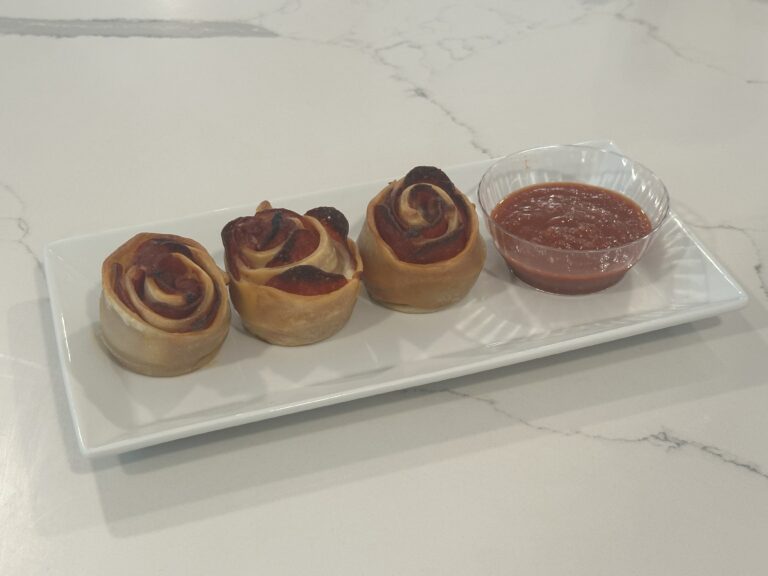 Homemade Pepperoni Pizza Roses baked in a muffin tin and served with marinara dipping sauce.
